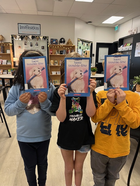 These three friends were pretty happy to all be borrowing the same book. #booklove #librarylove #booksandfriends #elementaryschoollibraries