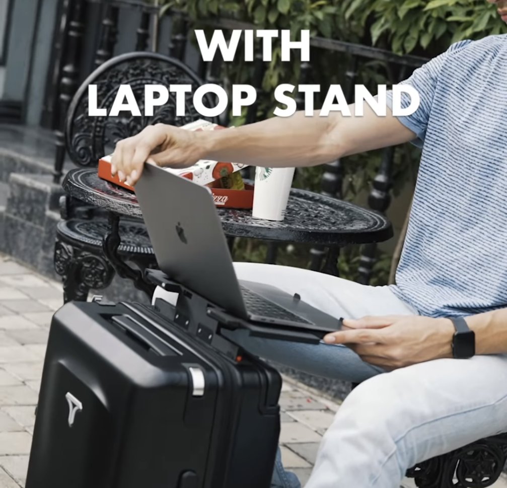¿Qué es está mamada y por qué me salió como anuncio? Una maleta con stand para tu laptop porque nunca debes dejar de trabajar, ni cuando estás esperando abordar un vuelo ALV