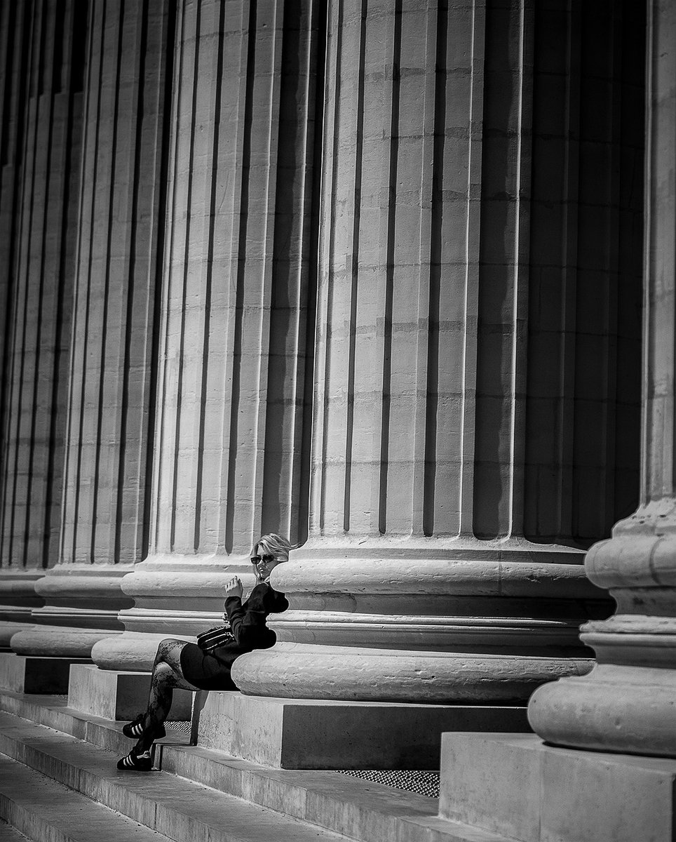 A tourist takes a break between the columns of the Elise de la Madeleine in Paris. A tourist takes a break between the columns of the Elise de la Madeleine in Paris. #sony #RX1R #sony #RX1Rm2 #bealpha #takeabreak #pillar #france #paris #styleblogger #staircase #blackandwhiteo ...