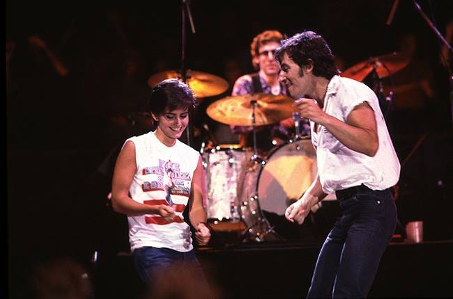 40 years ago today, Bruce Springsteen released ' Dancing in the Dark,' about his difficulty writing a hit single and his frustration trying to write songs that will please people. It becomes his biggest hit of his career with the help of Courteney Cox.