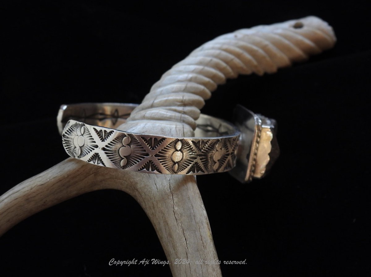 And it wasn't planned this way, but there's a matching cuff!  This is 'At the Crossroads of the Stars':  wingssilverwork.com/at-the-crossro….

Again, sterling silver and staurolite: