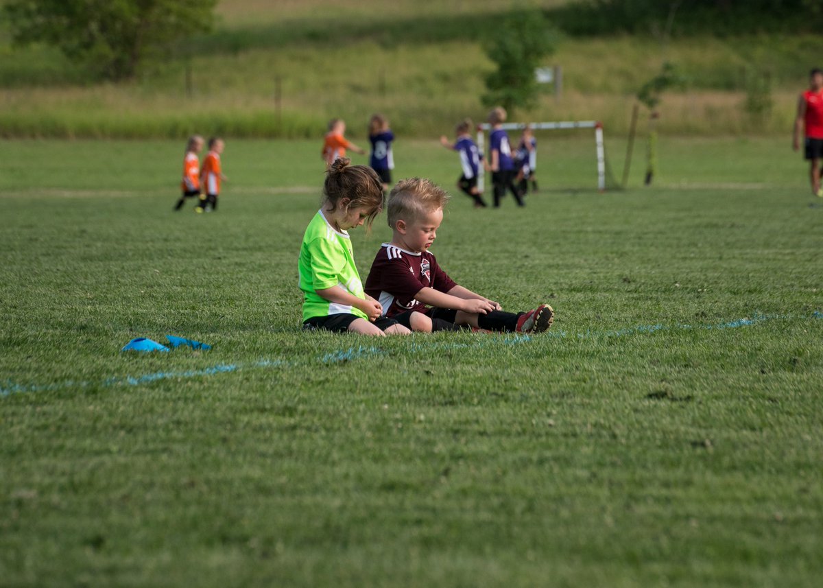 Love watching my kids play sports! Found these shots I took of my son playing soccer and making friends on the sidelines 😂🥹