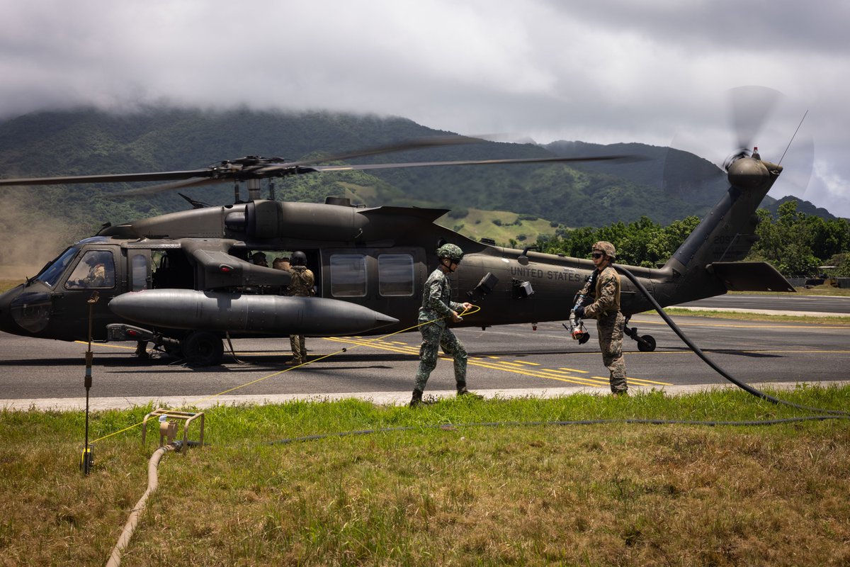 Philippine Marines and our #Marines at Balikatan 24 refuel a UH-60 Black Hawk in the Philippines.
