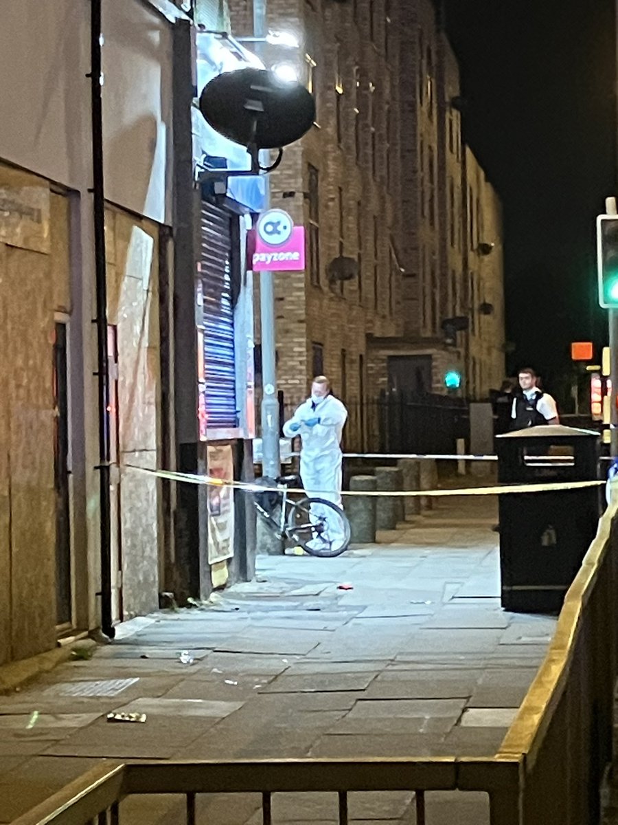 Forensics further inspect the bicycle outside GoLocal