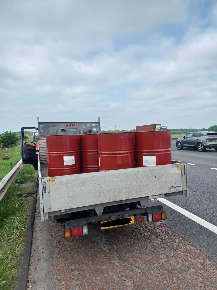Vehicle sighted M62 West J7.

20 oil drums in the rear not strapped/secured to the vehicle so able to bounce around as the vehicle went down the motorway. 

Driver had straps, but thought it was okay. 

Driver reported insecure load.