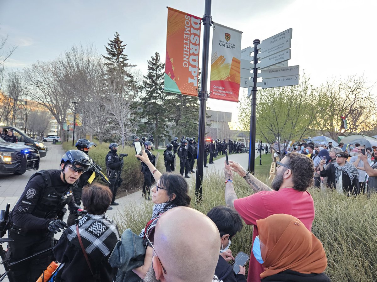 The University of Calgary put up signs saying, 'Disrupt something.' They didn't add, 'and when you do, we'll call in the riot police.'