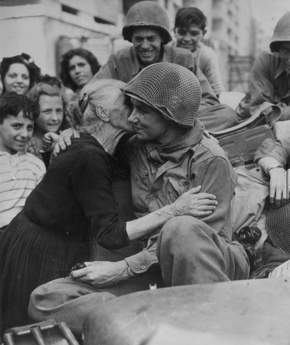 An Italian woman shows her gratitude to an American soldier following the liberation of Italy, 1945.