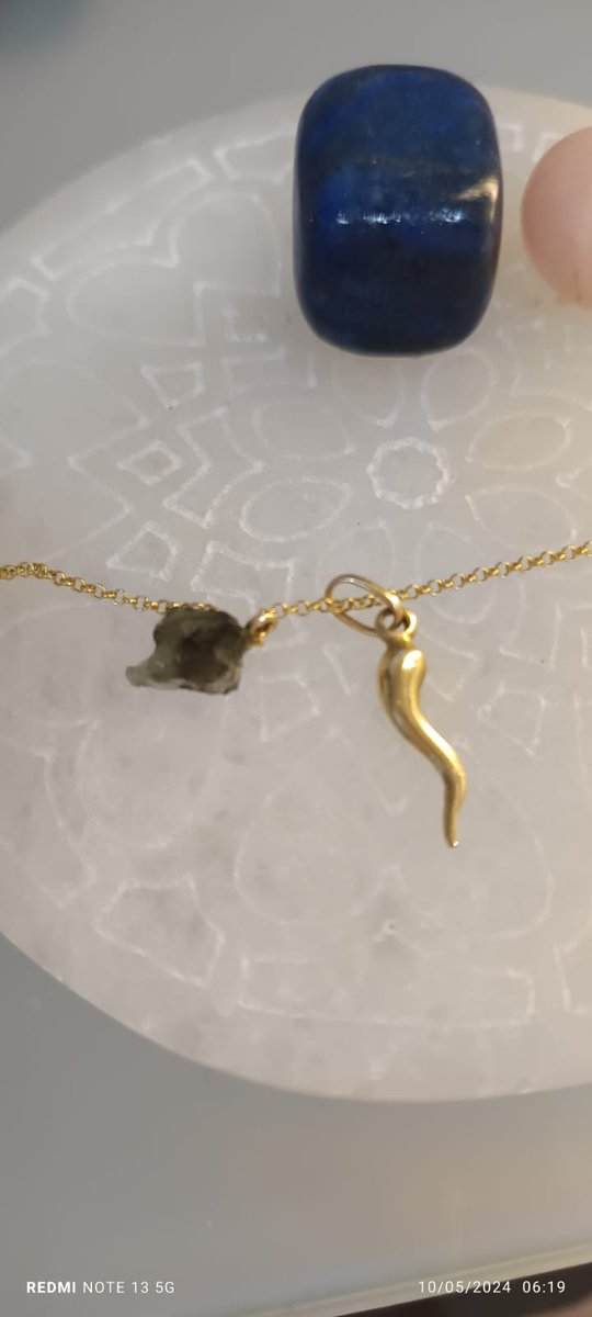 I am French of Italian origin and my grandfather gave me, when I was little, a cornucopia (commonly called the carrot) that I wear every day for years. 

A few days ago, I found a companion for it in the form of this small piece of moldavite, known for its properties as an…