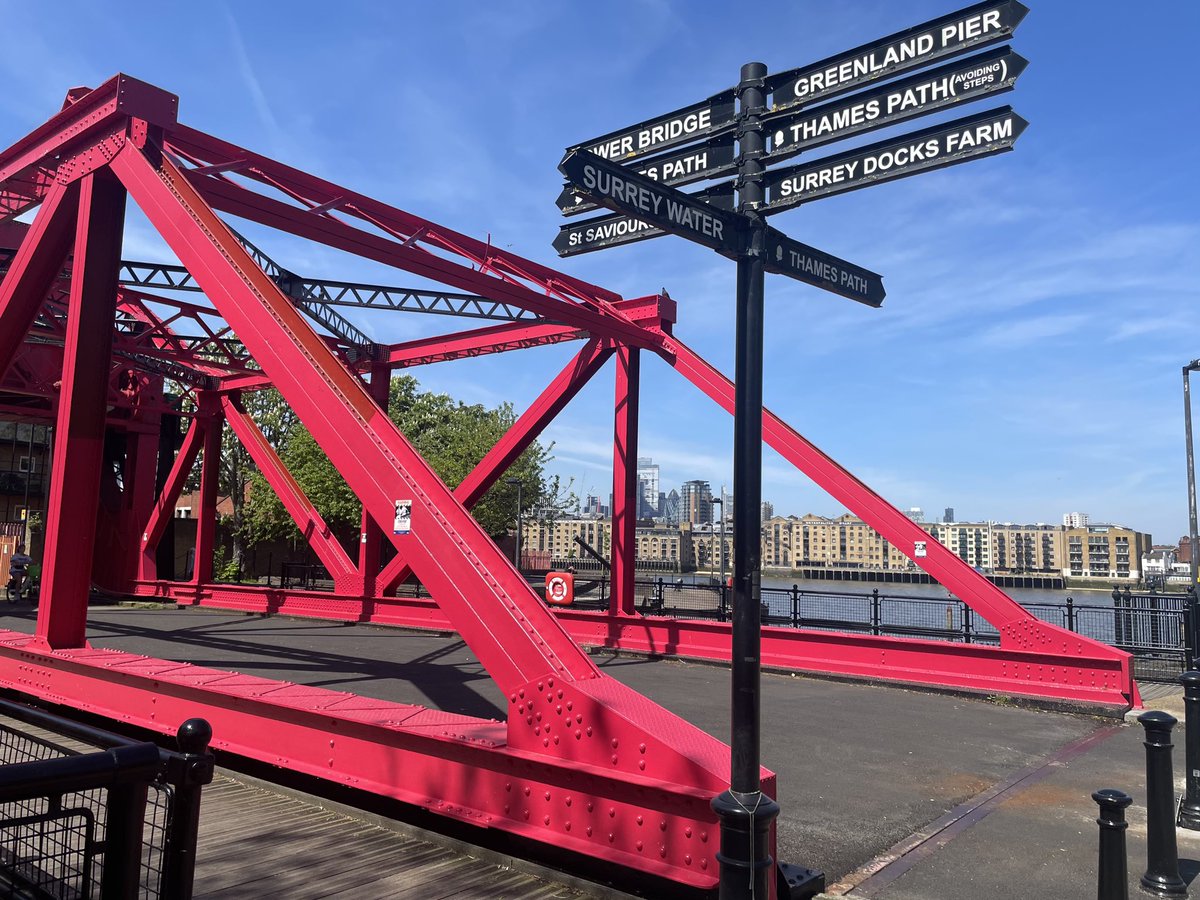Pedestrian signage next to a rather fine bascule bridge over a rebadged entrance to the Surrey Basin in Rotherhithe #FingerpostFriday