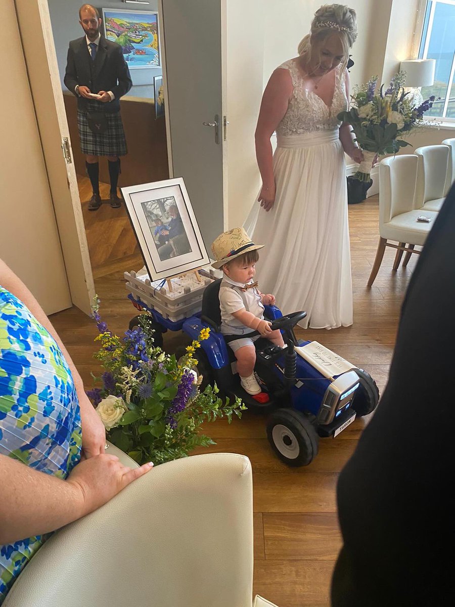 🥹 Angharad Morris’ dad passed away six weeks before he was due to walk her down the aisle, so instead, her son drove his grandad down it on a tractor.