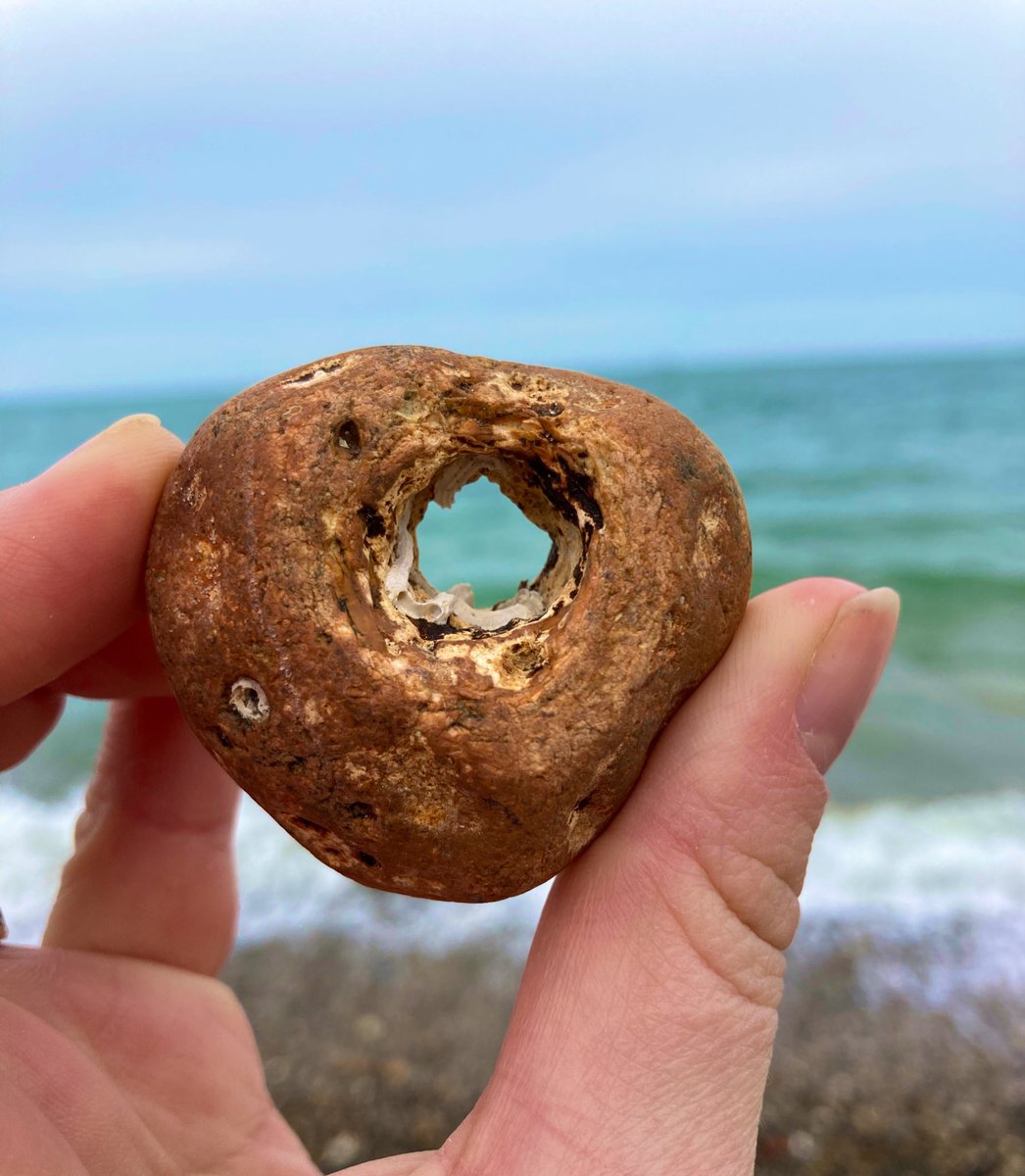 Hagstones are rocks found by the sea with naturally occurring holes in them. There are used to protect the bearer from evildoers or let the user see to other worlds. #FolkyFriday