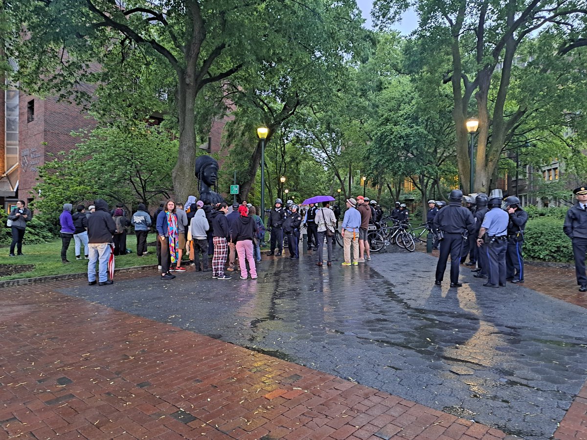 Dozens of Penn and Philadelphia Police officers equipped with riot shields and zip ties surrounded the more than two week old Gaza solidarity encampment at Penn’s College Green early Friday morning. Police blocked access to the green as supporters waited on the periphery.