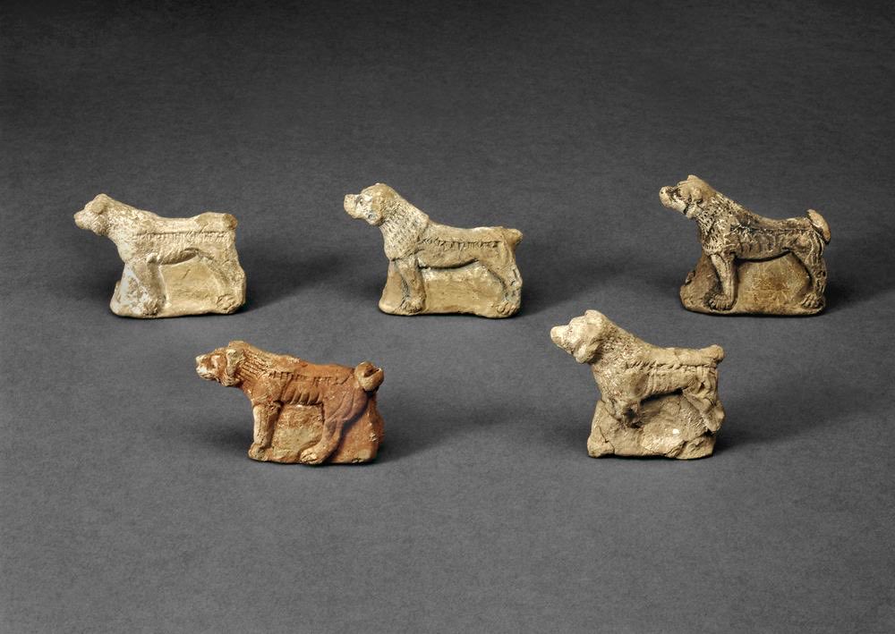 Neo-Assyrian dog figurines found at Nineveh and produced around 645 BC with the inscription “dan rigiššu” or “Loud is his bark!”