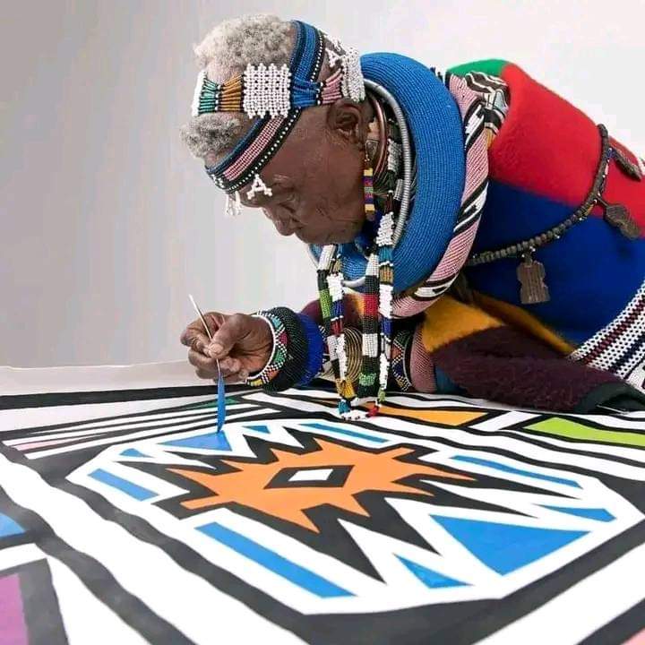 Legendary Esther Mahlangu(87) 🇿🇦 . She decorates cars and houses in an exotic and exceptional way. She is the first person to transfer the traditional Ndebele style of mural painting to canvas.