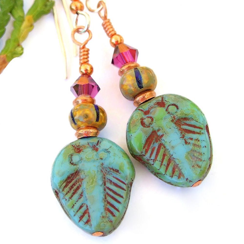 Fun #jewelry for a #fossil lover: glass #trilobite #earrings w/ African trade beads & fuchsia #Swarovski crystals! via @ShadowDogDesign #ShopSmall #FossilLover #Handmade #TrilobiteEarrings bit.ly/PrimordialSD
