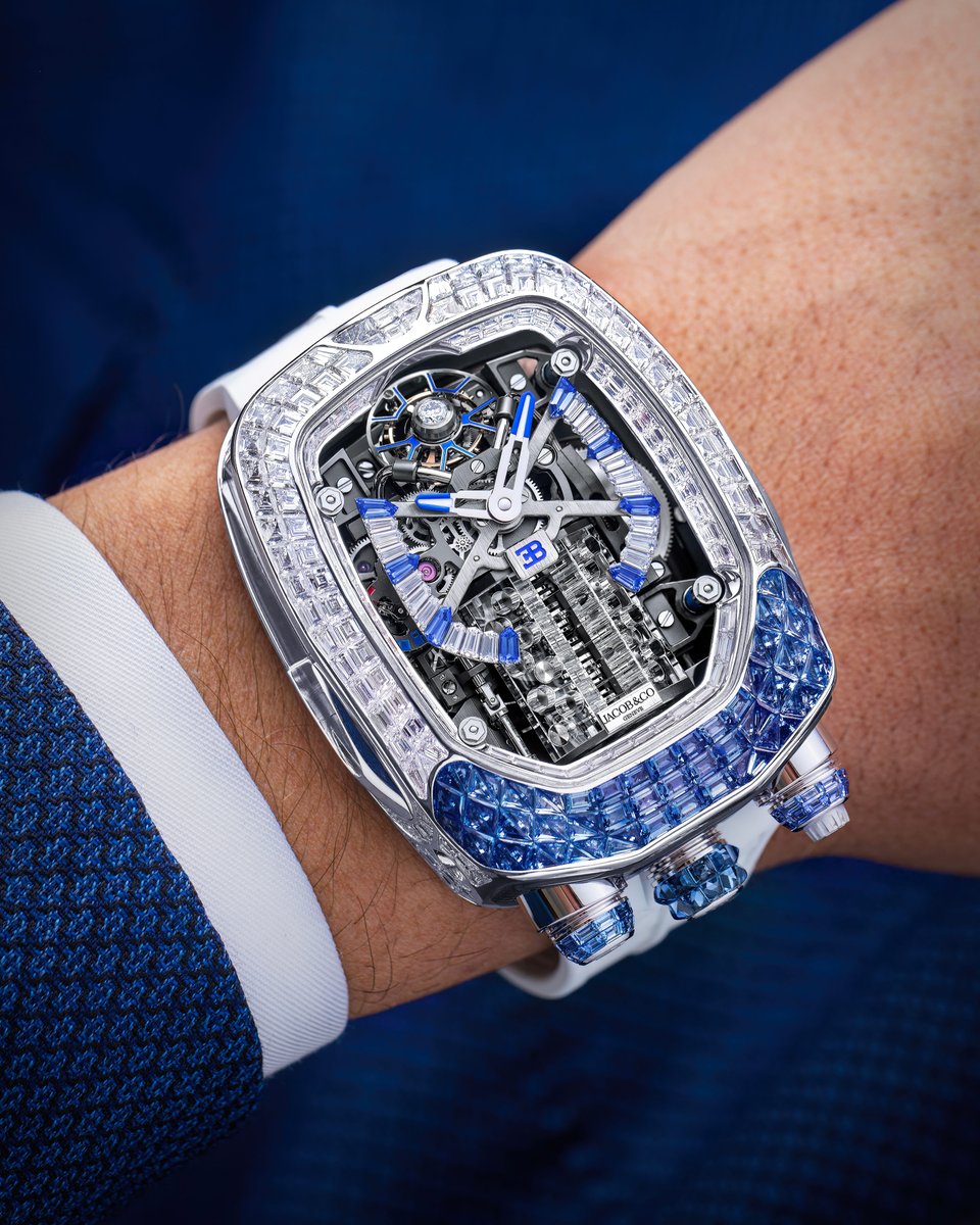 Discover the elegance of the Jacob & Co. Bugatti Chiron Baguette, now reimagined in 18K white gold with captivating blue sapphires. This exquisite timepiece features a unique 'W16 engine' animation beneath an anti-reflective sapphire crystal, framed by 266 white diamonds.