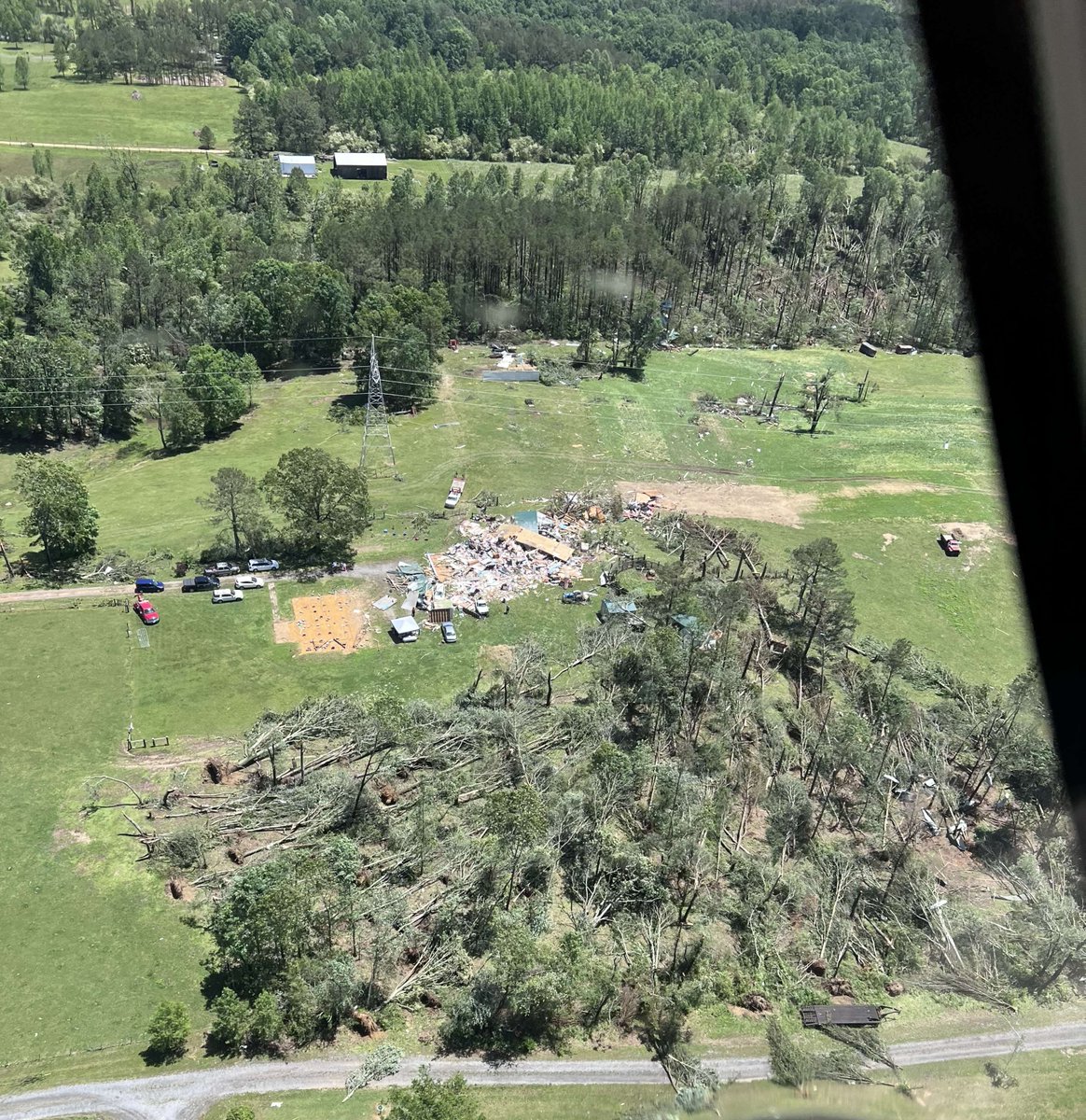 Our crews worked safely and quickly to restore service to back to Sand Mountain Electric Co-Op after severe weather damaged two transmission lines in Dekalb County. A @TVAnews helicopter captured this image in Henegar, AL. Our thoughts are with those impacted by the storms!