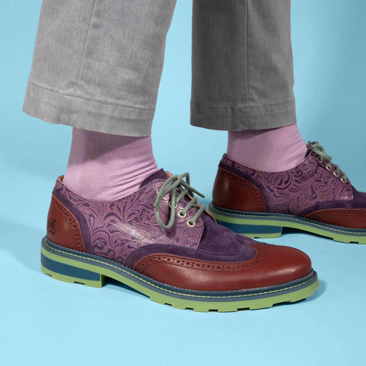 Purple paisley perfection & swoon-worthy sophistication! 💜 Peep the #FluevogDay #LimitedEdition LOTUS & NATHANIEL! 🤩 Available May 15. ⁠ Plus, here's a look at our early bird in-store giveaway... The Bhadra Vog Socks in a matching colo(u)rway! Details: vo.gg/fluevog-day