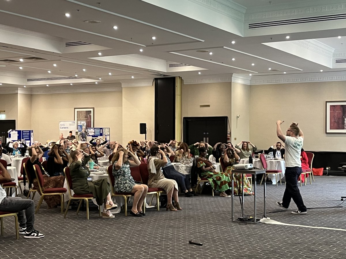 CWPT_NHS's tweet photo. Lots of energy in the room as Aaron from @laughtercise1 got our nurses on their feet to beat the after-lunch slump at our international nursing day event! ⭐️ https://t.co/U3kbOaCW08