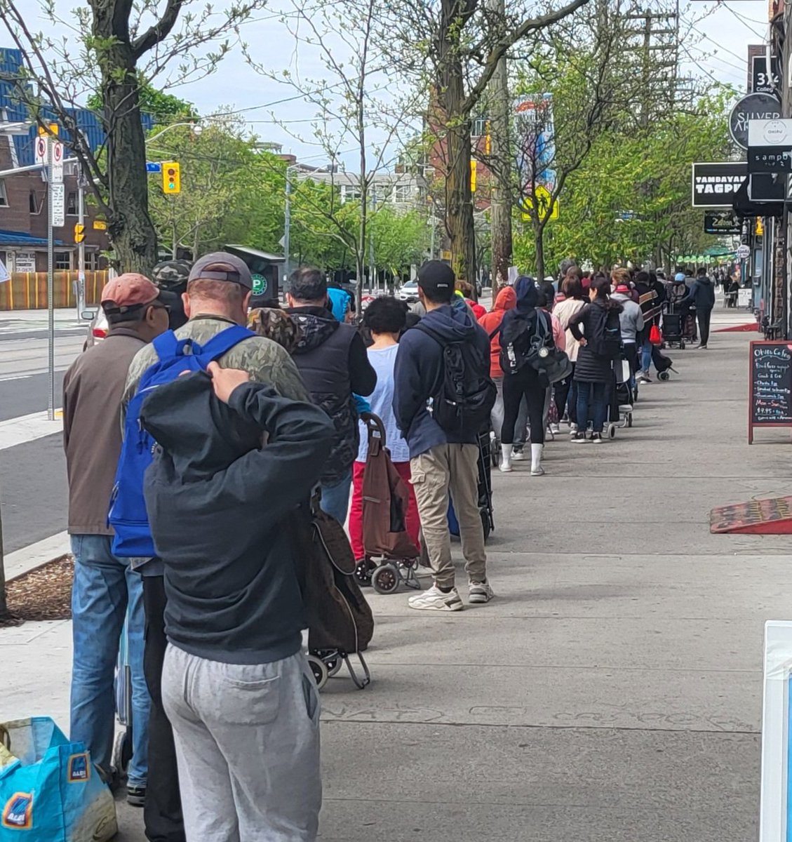 Lineup at the Fort York Food Bank this morning. It's an entire block long. This is Chrystia Freeland's riding. For shame.
