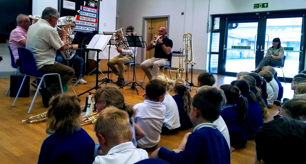 Today we enjoyed a #performance  from members of the #Cranbrook Town Band who shared their love of playing a brass #instrument .  Our very own Mrs Walsh joined in demonstrating her Trombone skills.