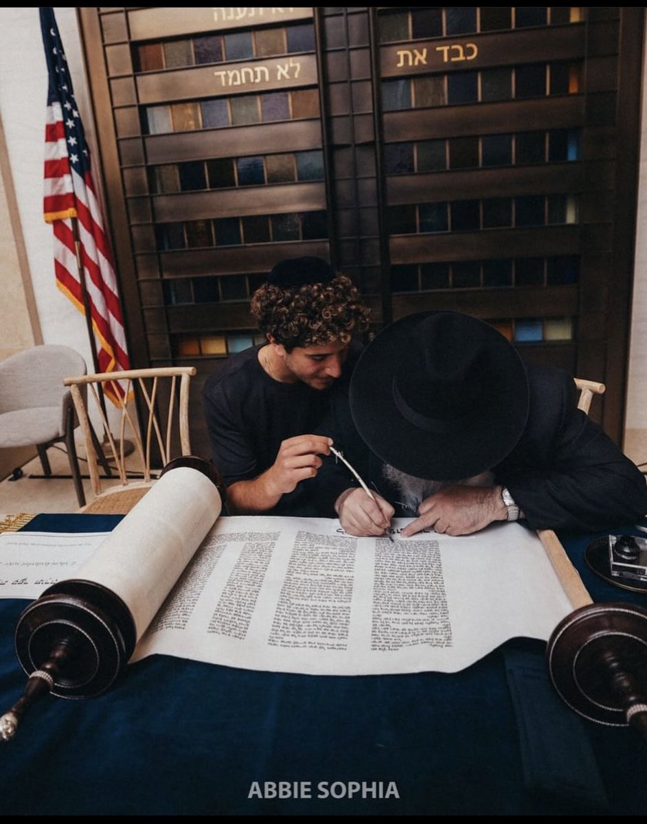 Tomer Meir, one of the organizers of the NYC Nova Exhibition (@novaexhibition) who miraculously escaped the Nova massacre, writes the letter “ה” (hey) in the Torah. 

In Jewish mysticism, it is believed the letter “ה” (which is also the number 5) represents light, because the