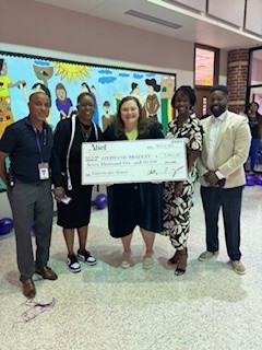 OwensInt's tweet photo. What an exciting time yesterday witnessing our fabulous Band Teacher Ms. Bradley receive her check for her TIA distinction, congratulations and thank you for all of your hard work. @OwensInt @AliefISD https://t.co/1b9W9AHMYx