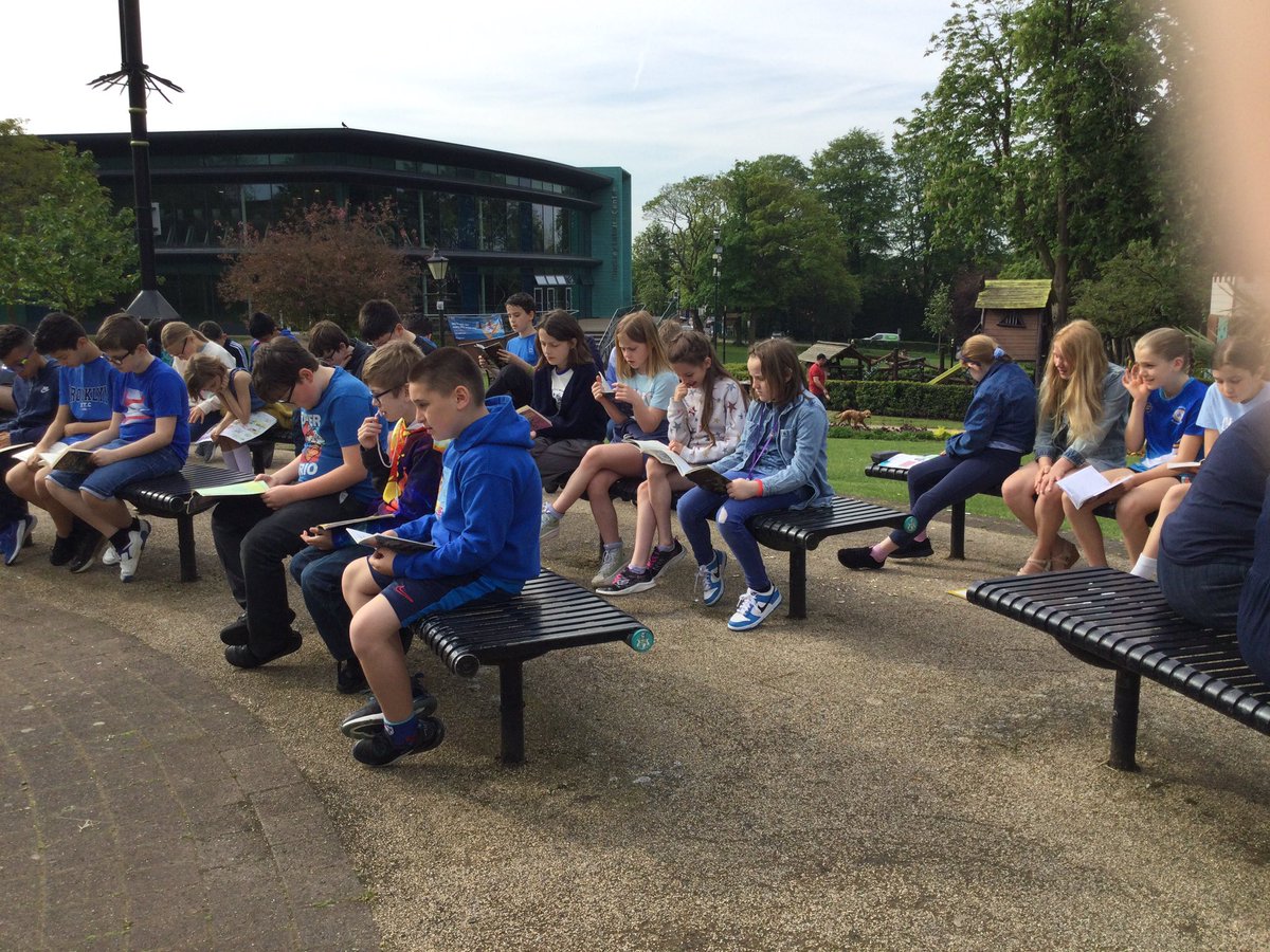 StMarys_Hinck's tweet photo. Year 5/6 enjoying a read in the sun this morning. #reading #beingoutside https://t.co/nGz7sVjKSf