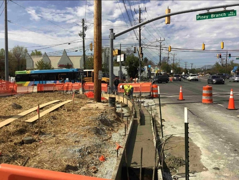 Crews pour concrete for curb and gutter work along Piney Branch Road @MontgomeryCoMD. Once complete, the Purple Line will travel along University Boulevard and Piney Branch Road, then pass through the Plymouth Tunnel heading into and out of Silver Spring.  #purplelineprogress