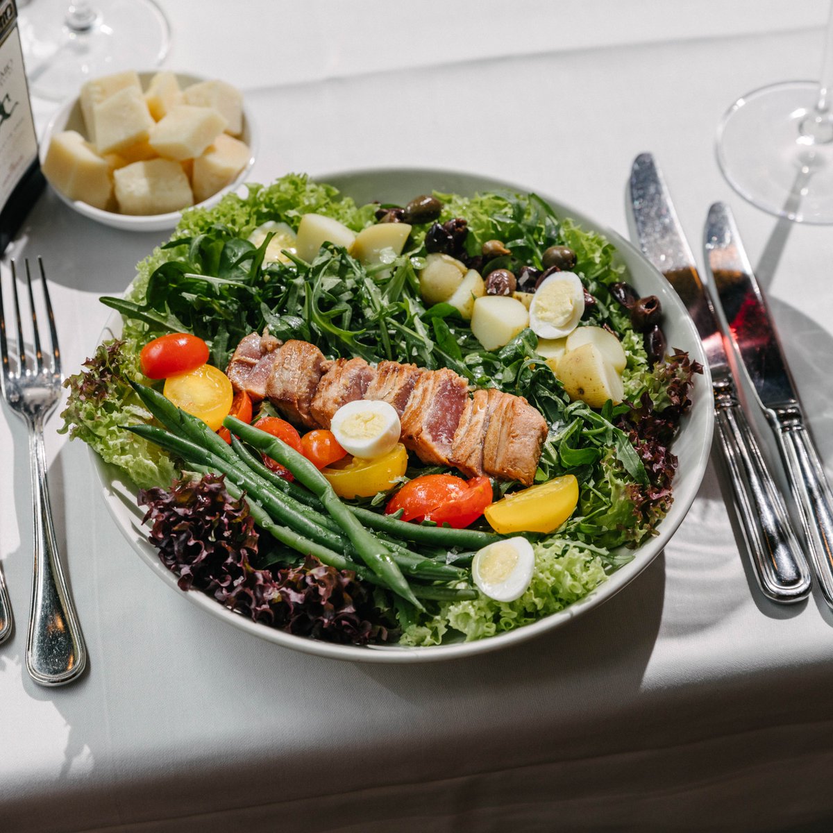 Savouring the flavours of a classic Nicoise salad, a taste of the French Riviera, freshness in every bite