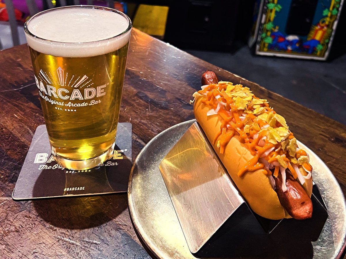 🌭 The “Spicy Pikliz Dog” is our 'Dog of the Week — topped with housemade Haitian-style spicy pikliz, a spicy chile-tomato sauce, and crushed plantain chips. #Barcade #JerseyCity #NJ