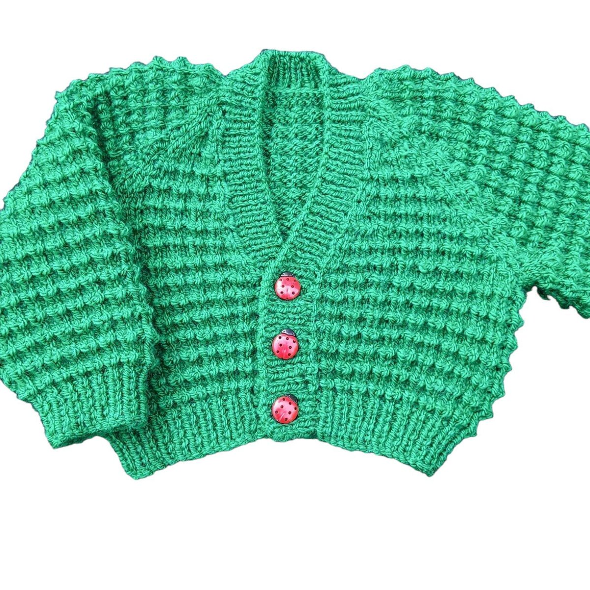 Discover this charming emerald green baby cardigan, hand knitted with a unique textured pattern and delightful ladybug buttons. Ideal for 0-3 month old babies or reborn dolls. Shop now on #Etsy at #Knittingtopia! knittingtopia.etsy.com/listing/168538… #craftbizparty #MHHSBD #knittedbabyclothes