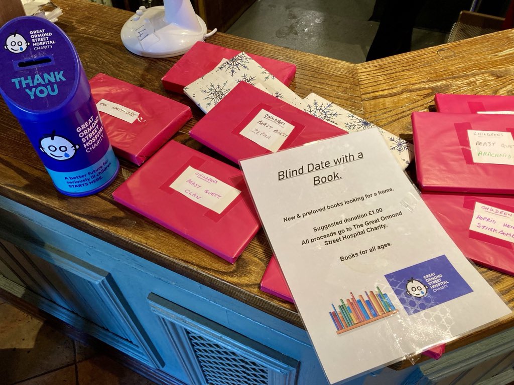 Lovely 'Blind Date with a Book' idea in the @premierinn restaurant, raising money with pre-loved books for @GreatOrmondSt children's hospital ❤️📚 #books #amreading #PremierInn #book
