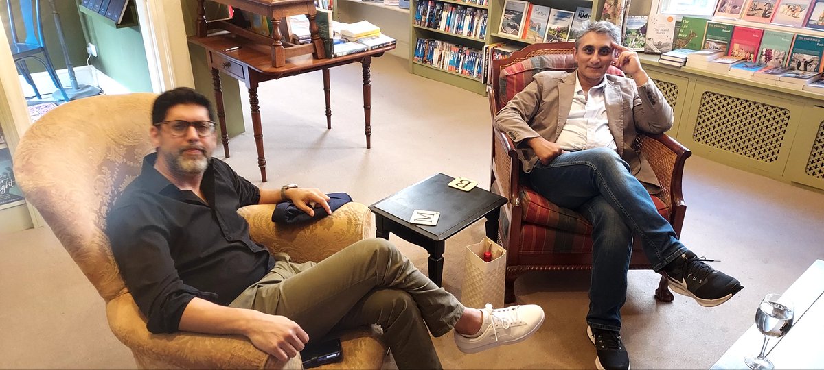 Sitting with @radiomukhers in the 'book spa' at @mrbsemporium in Bath, waiting for our event to start. Our expressions indicate serious thought. Or dodgy stomachs.