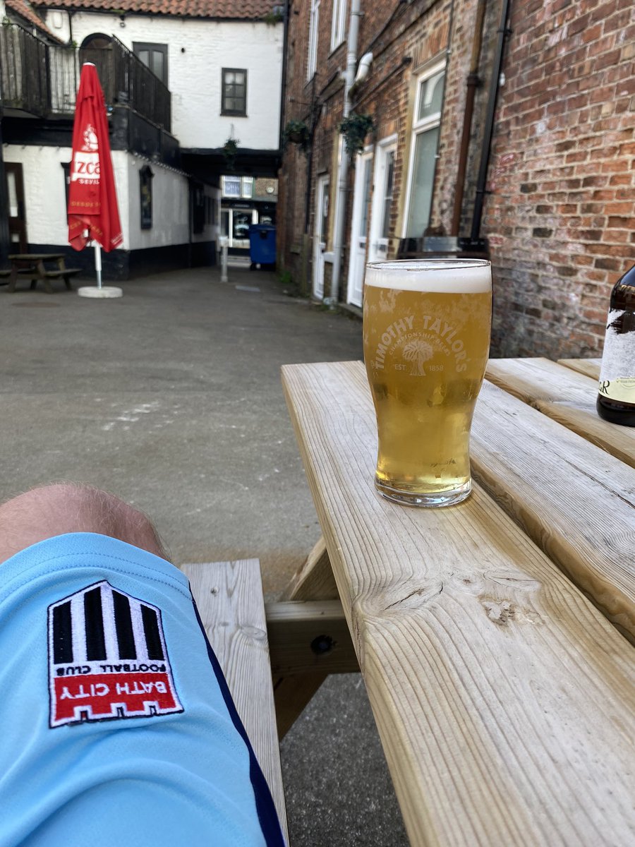 Katie’s spending the night before the wedding having a sophisticated evening with the bride and bridesmaids. I’m drinking pints in Thirsk whilst wearing Bath City shorts