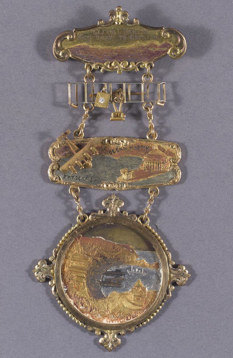 Glenn L. Martin made the first extended over-ocean flight on #TDIH in 1912. He flew from Newport Bay, California, to Catalina Island, a total of nearly 70 miles. This medal from our collection commemorates that flight.