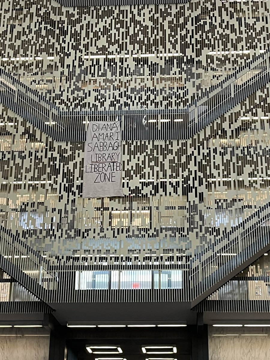 When students began killing themselves at Bobst, NYU responded—not by creating a less toxic school environment—but by erecting a suicide barrier. Now a banner, describing Bobst as a liberated zone, hangs from that same barrier. Free Palestine.