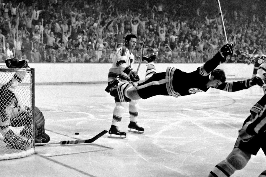 Today in 1970, #BostonBruins defenseman #BobbyOrr scored in overtime to sweep the St. Louis Blues and win the #StanleyCup. Tripped as he shot, Orr raised his arms in victory as he flew through the air, making it one of the most iconic goals in #NationalHockeyLeague history.