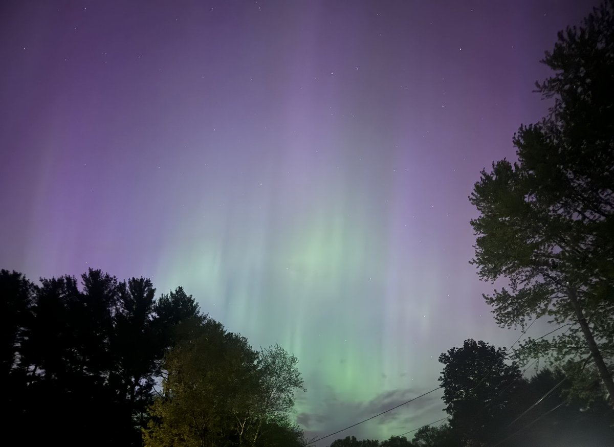 Never seen Northern Lights like this before in Tolland CT - visible to the north, east, and west with the naked eye and even a bit right overhead! This is just a with a simple iPhone pic