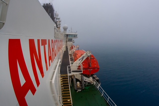 Shrouded in fog, RSV Nuyina arrived at Macquarie Island this morning. It'll have to lift before helicopter operations can start. 📷Pete Harmsen