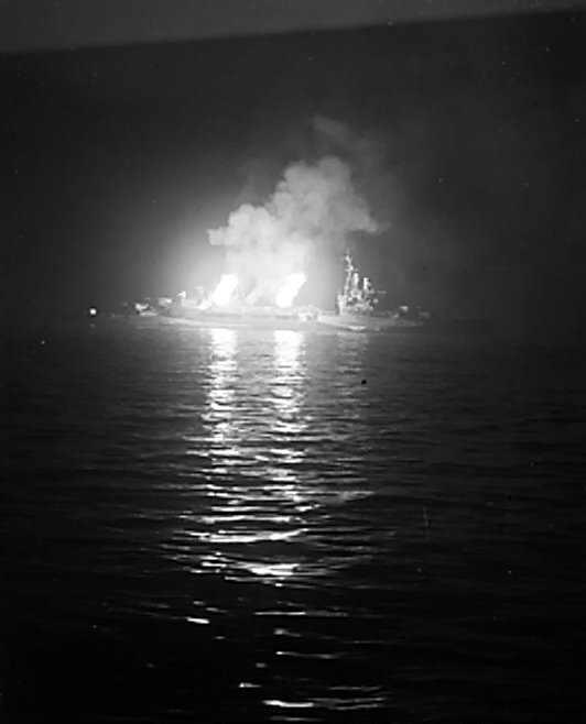 Cruiser HMS Belfast bombarding German positions off Normandy, France, 24-25 Jun 1944