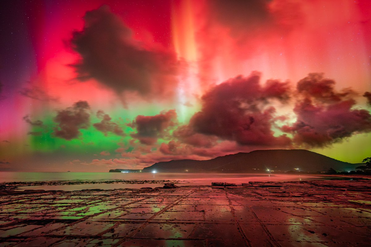 Absolutely biblical skies in Tasmania at 4am this morning. I’m leaving today and knew I could not pass up this opportunity for such a large solar storm. Here’s the image. I actually had to de-saturate the colours. Clouds glowing red. Insane. Shot on Nikon. Rt appreciated