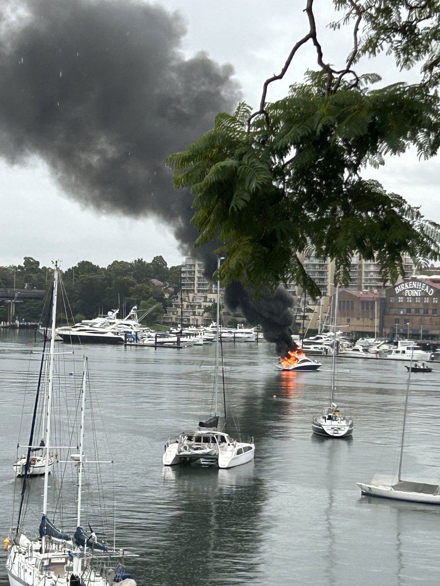 Boat spontaneously catches fire in the pouring rain #sydney #balmain