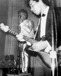 Jimi Hendrix playing guitar for Little Richard, 1965.