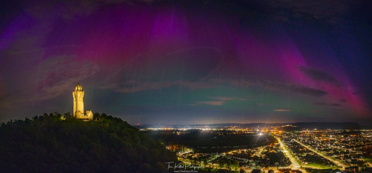 I'm honestly speechless at the northern lights tonight. Here is one wide shot of the city of Stirling with The National Wallace Monument and Stirling Castle towering in the distance. I took loads of photographs but off to bed now, kids are up in 4 hours :) #Stirling…