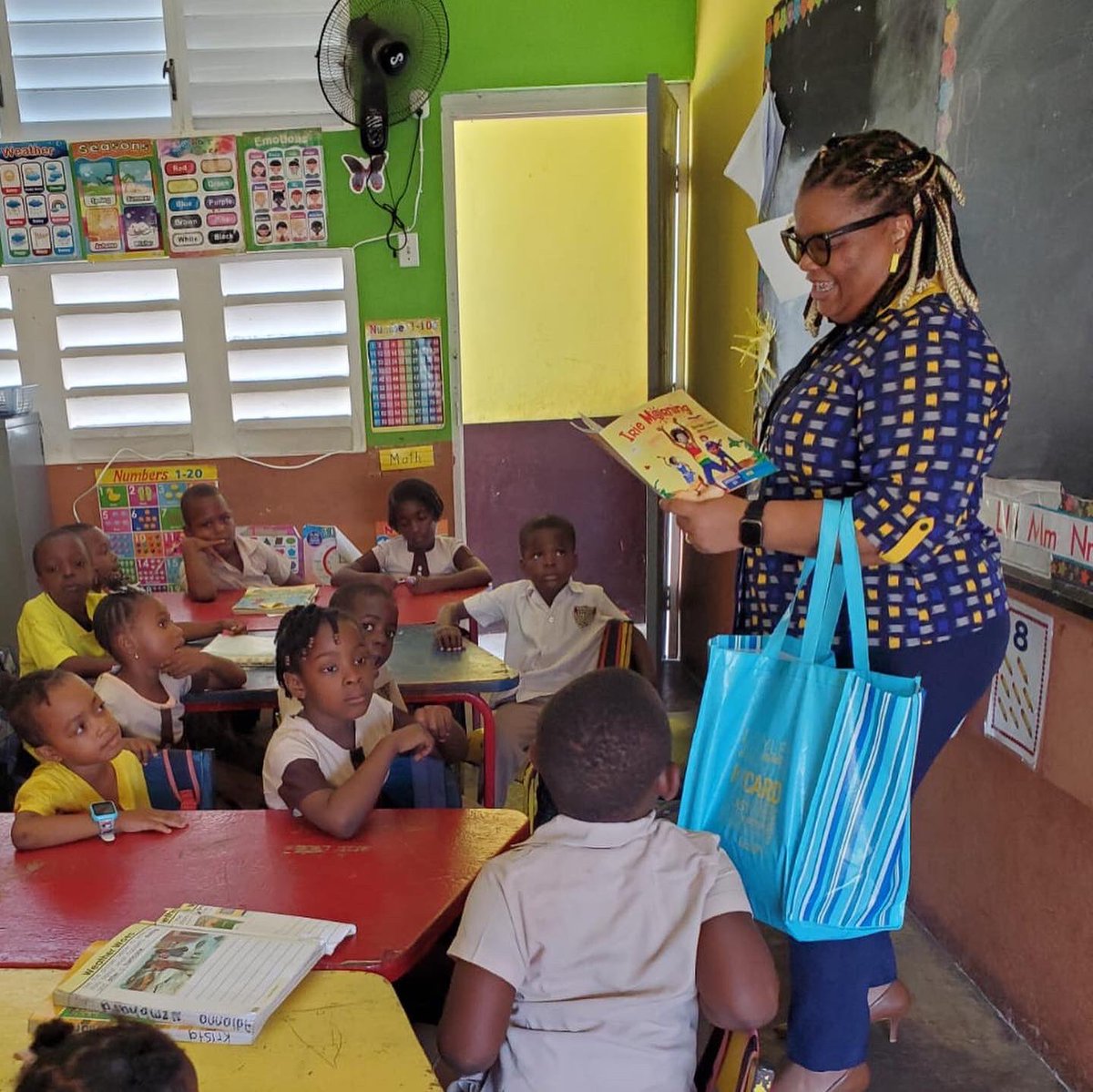 Teteena Williams, from NCB Old Harbour, brought smiles and stories to the little learners at Blackwood Gardens Basic School for Read Across Jamaica Day. 🌟 .. #EmpoweringPeople #UnlockingDreams #BuildingCommunities #ReadAcrossJamaicaDay #LiteracyInitiative #NCBCommunityOutreach