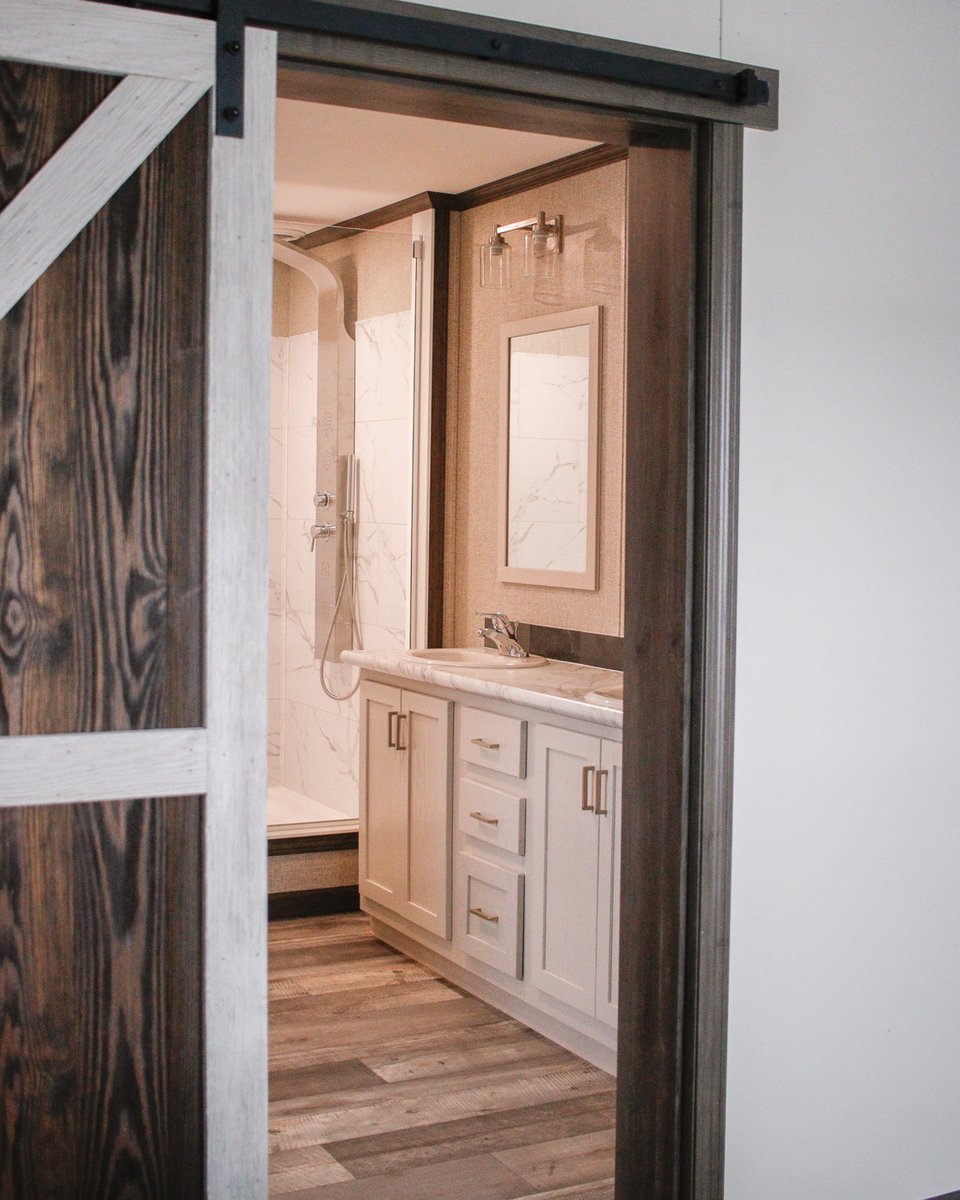 The Aberdeen master bathroom - the sliding barn door, the double vanity and the walk-in shower 🤌✨

#modularhome #canadianhomes #doublewidehomes