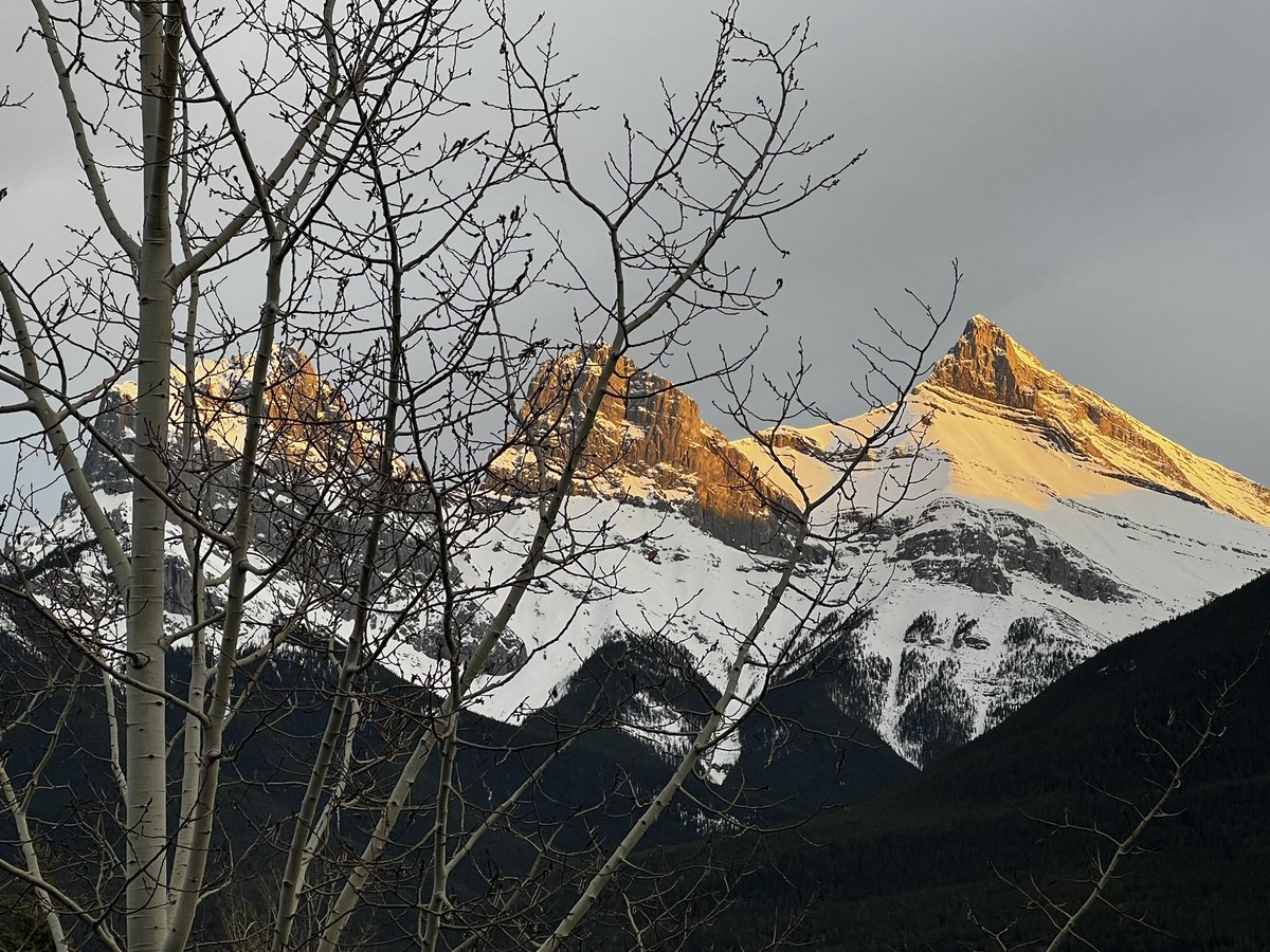 In Canmore tonight with my two sister-in-laws. The sun kissed “Three Sisters” and the mountain behind.