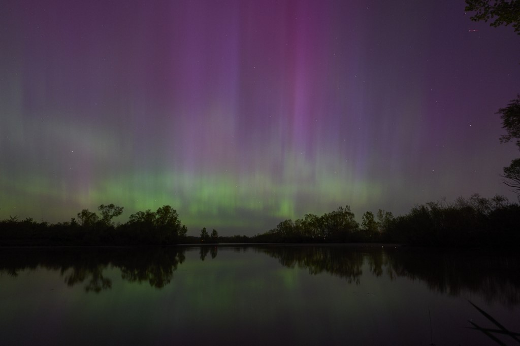 IN PICTURES: A powerful solar storm has painted skies in parts of North America and Europe with a dazzling aurora borealis display. The geomagnetic activity could also disrupt satellites and power grids cna.asia/4aiLZ7R (Photos: AFP, AP)