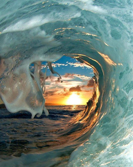 Photographer Clark Little captures the best moments before a wave crashes: in this photo he got what we could define the light at the end of a wave.